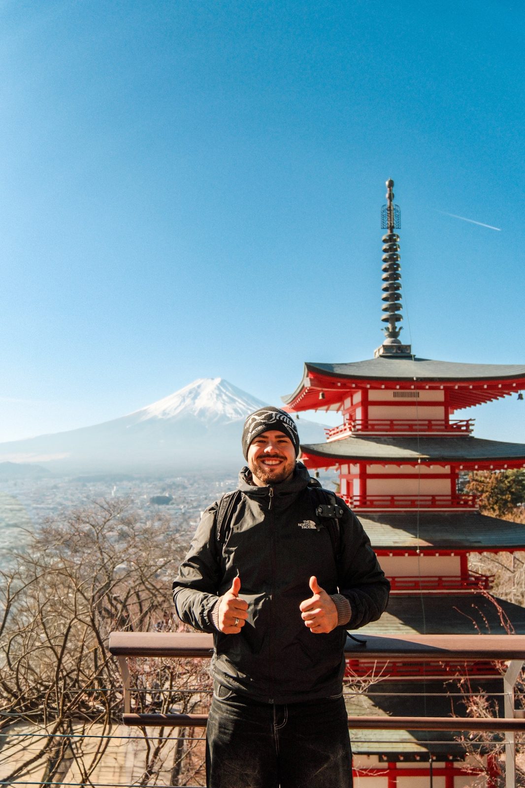Tim smiling in front of the Chureito Pagoda with Mount Fuji behind