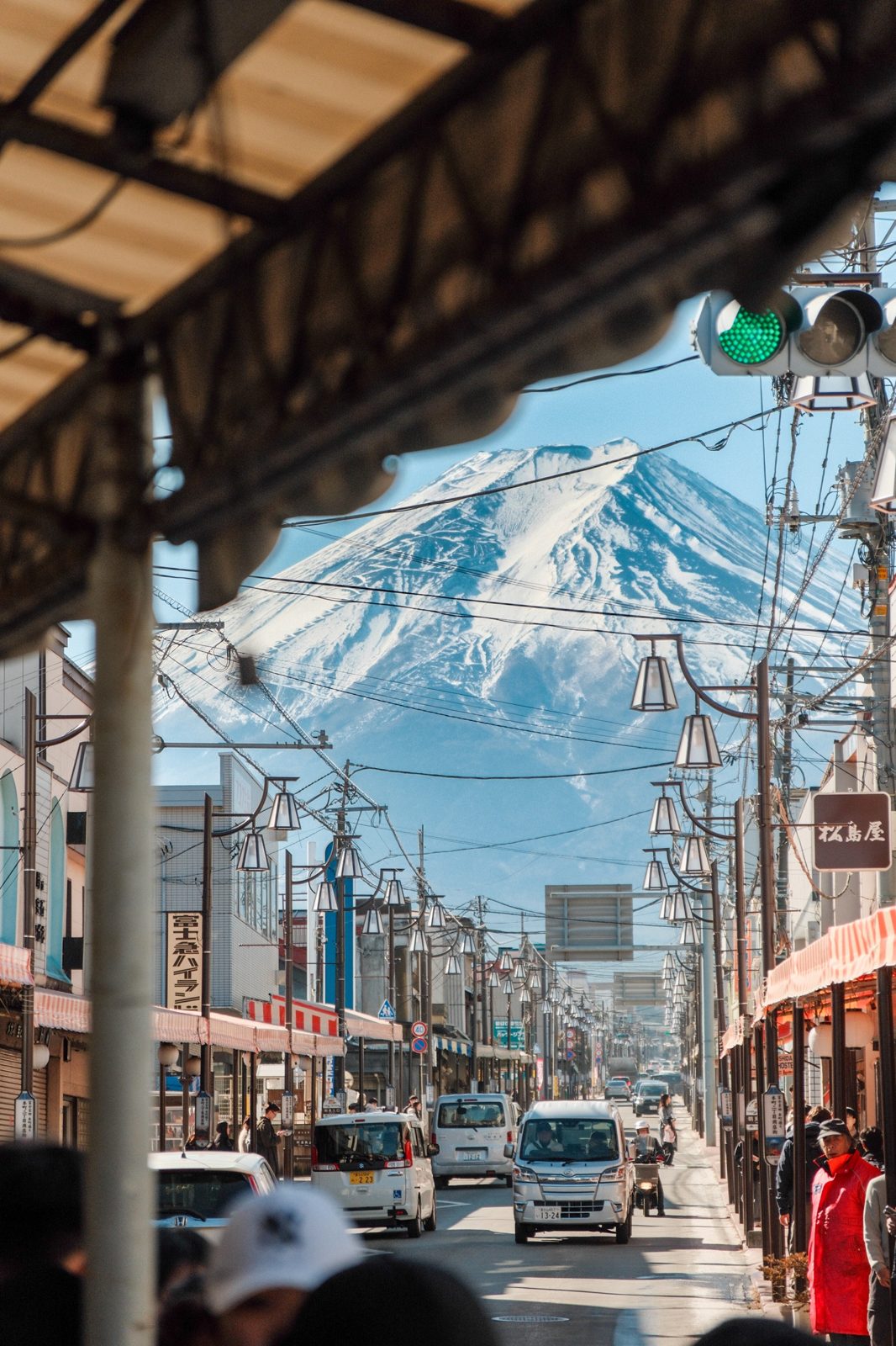 Mount Fuji seen down a shopping street in Fujiyoshida